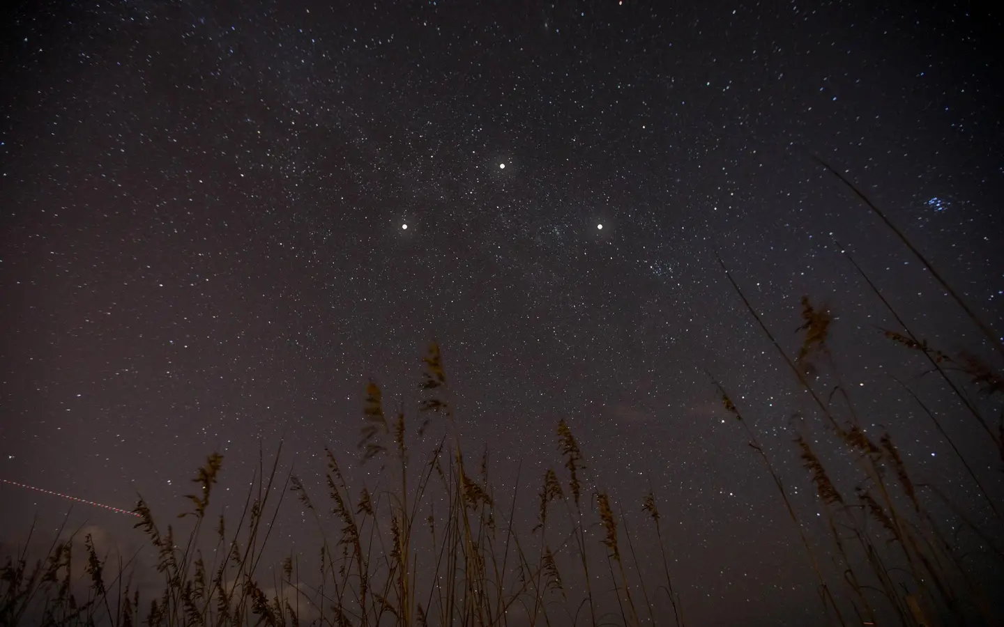 Photographic reconstruction of three lights in a triangular formation at night